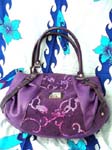 Designer handbag factory distributes Classy evening wear purse in vibrant purple with fun sequin design.