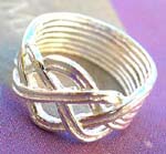 Puzzle ring jewelry wholesale store. Sterling silver puzzle ring design with interwoven, celtic knot style top